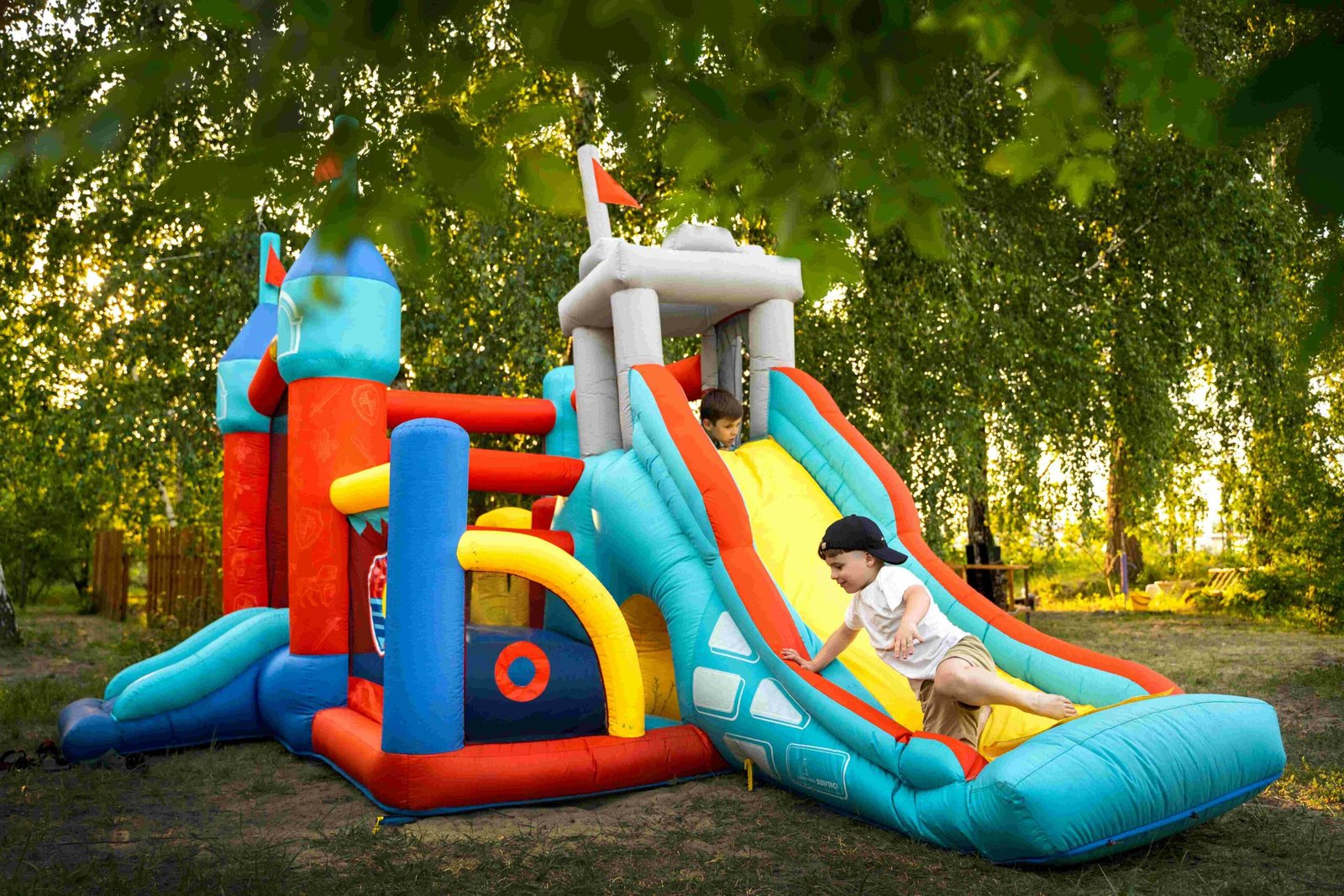 compressed_full-shot-kid-playing-bounce-house